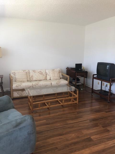 1044 Rexford Drive Boca Raton, FL 33434 - Photo 9 of 50 a living room with furniture and a wooden floor