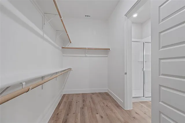 a view of an empty walk in closet