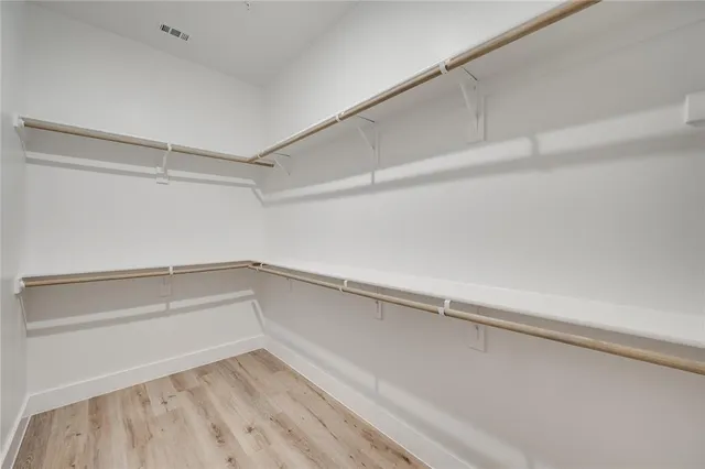 a view of an empty walk in closet