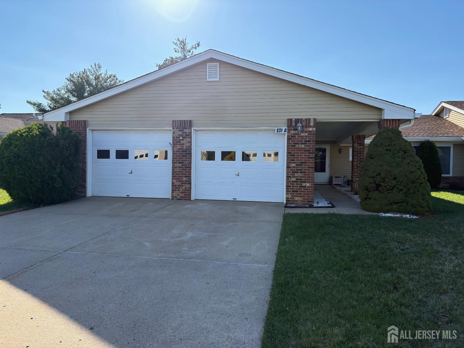a view of garage and yard
