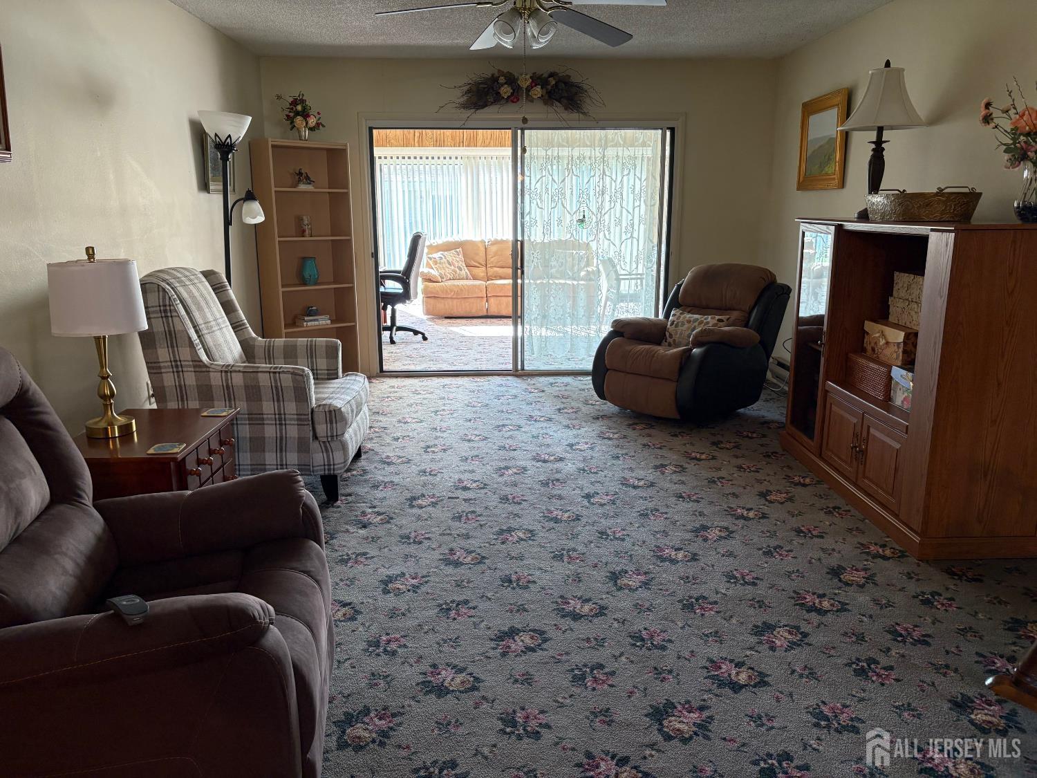 531 Ardmore Road, Unit 531A Monroe Township, NJ 08831 - Photo 4 of 5 a living room with furniture a flat screen tv and a window