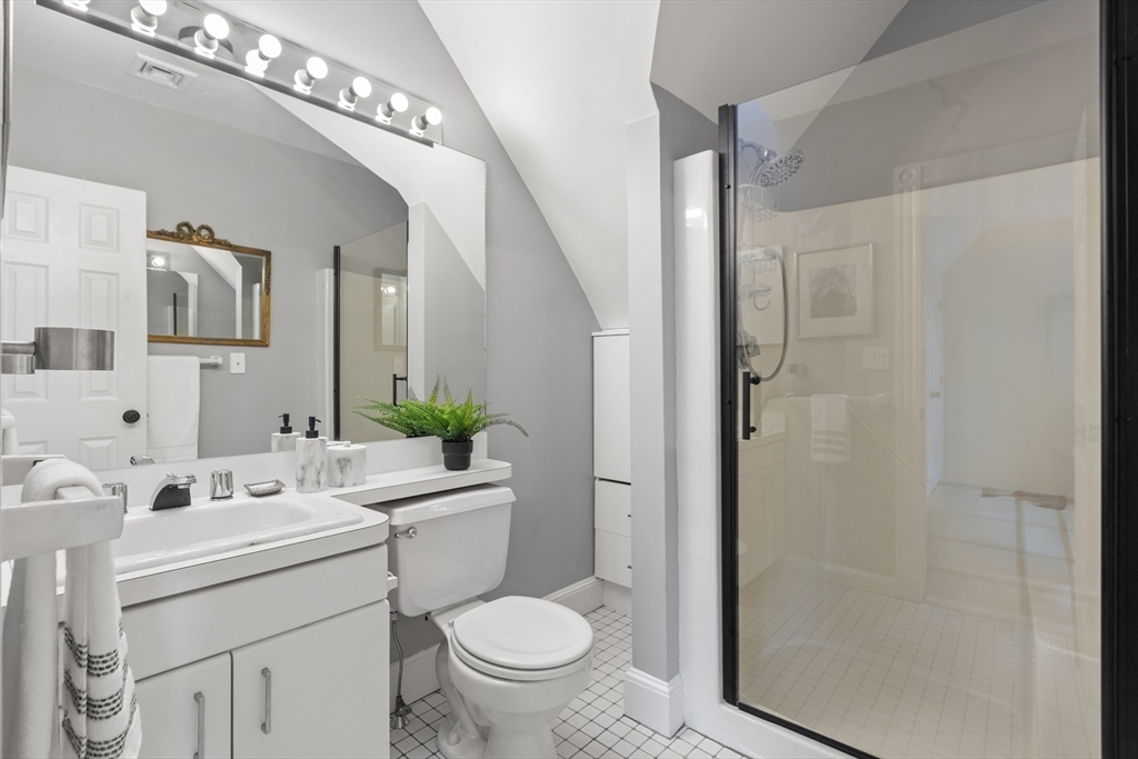 169 Walnut Street, Unit 2 Boston, MA 02122 - Photo 20 of 42 a bathroom with a sink toilet and shower