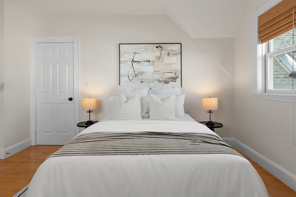 169 Walnut Street, Unit 2 Boston, MA 02122 - Photo 21 of 42 a large white bed in a white room