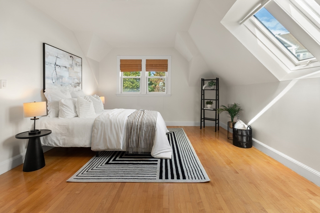 169 Walnut Street, Unit 2 Boston, MA 02122 - Photo 22 of 42 a living room with furniture and a lamp