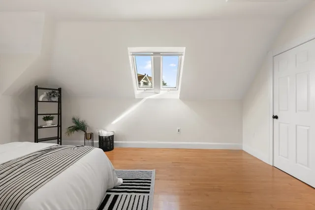 a view of a lake with lawn chairs