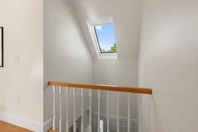 a sign that is sitting in front of flowers