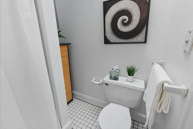 a view of a house with a big yard and large trees