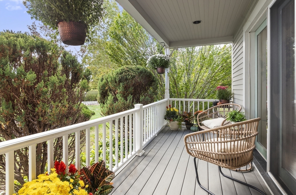 169 Walnut Street, Unit 2 Boston, MA 02122 - Photo 29 of 42 a view of a chair and table in the balcony