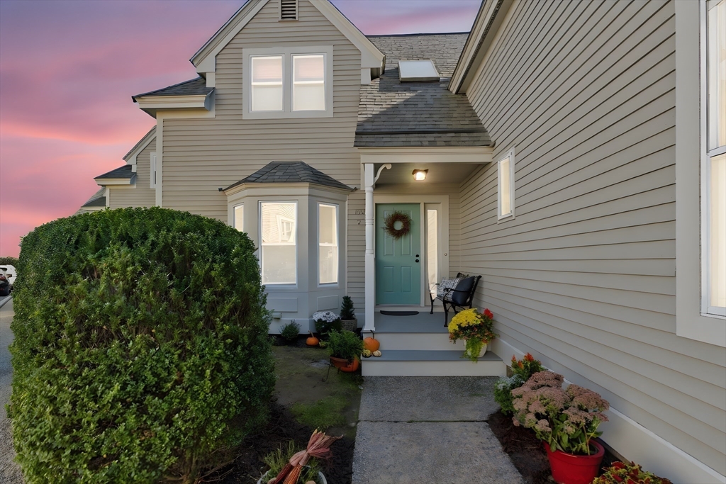 169 Walnut Street, Unit 2 Boston, MA 02122 - Photo 42 of 42 a front view of a house with a yard