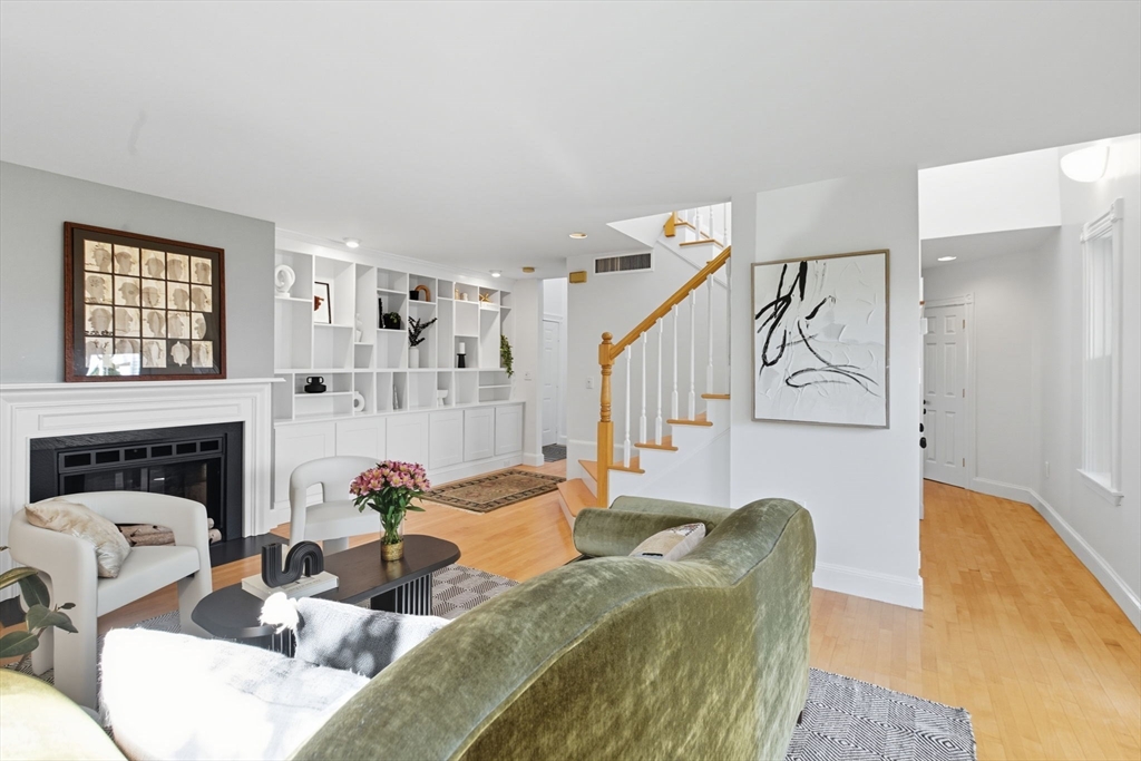 169 Walnut Street, Unit 2 Boston, MA 02122 - Photo 7 of 42 a living room with furniture and fireplace