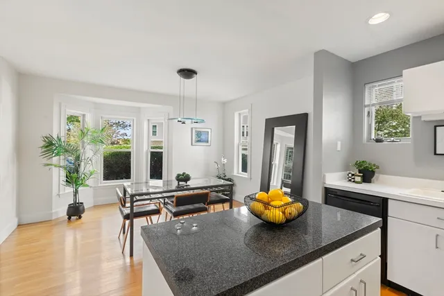 a large white bed in a white room