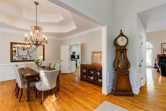 a living room with furniture large window and flat screen tv