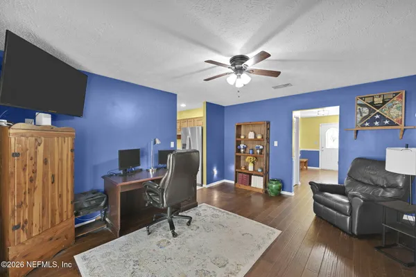 a living room with furniture fireplace and a flat screen tv