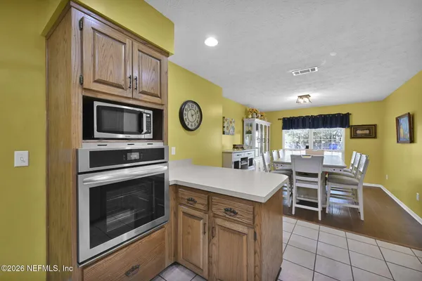 a kitchen with a stove and a microwave