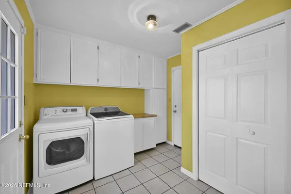 a utility room with dryer and washer