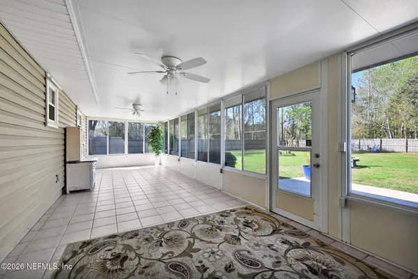 a view of an entryway with a floor to ceiling window