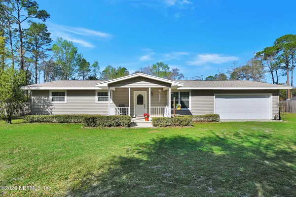front view of a house with a yard