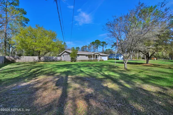 a view of a house with a big yard