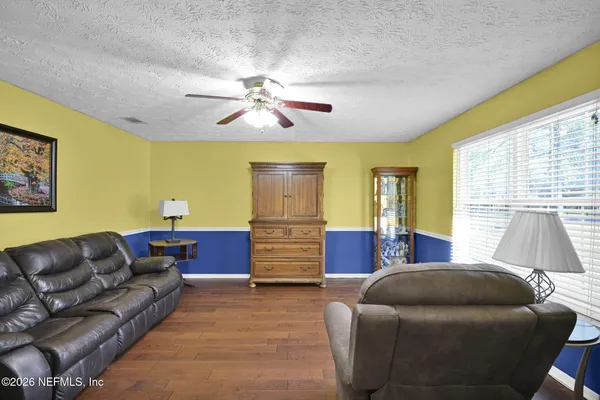 a bedroom with a bed and couch