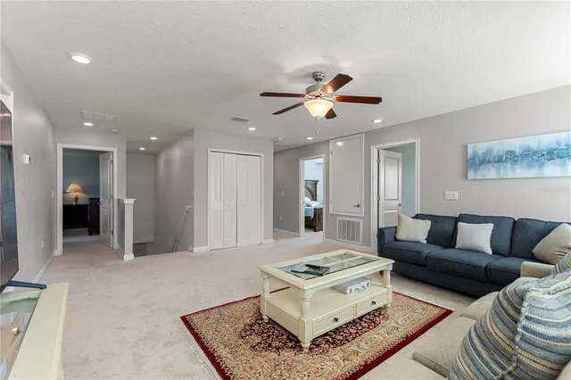 a living room with furniture and a rug
