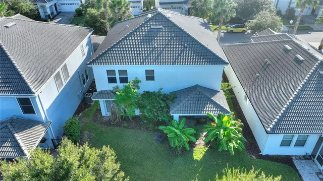 a aerial view of a house with a yard
