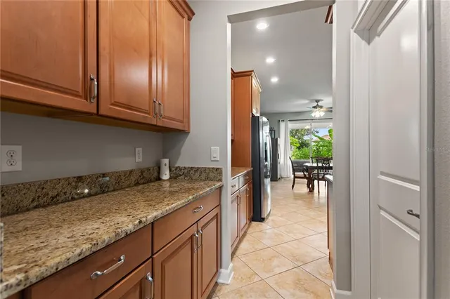 a kitchen with granite countertop a sink and cabinets