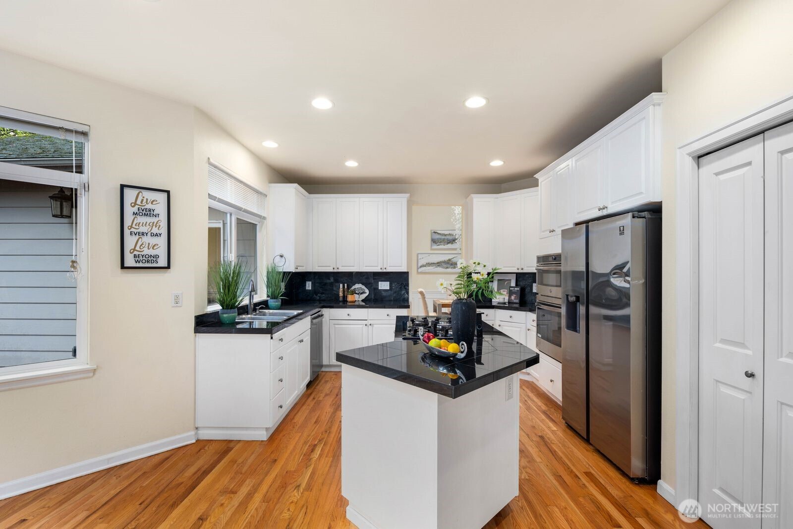 3429 Lincoln Avenue Northeast Renton, WA 98056 - Photo 15 of 40 a kitchen with white cabinets and stainless steel appliances