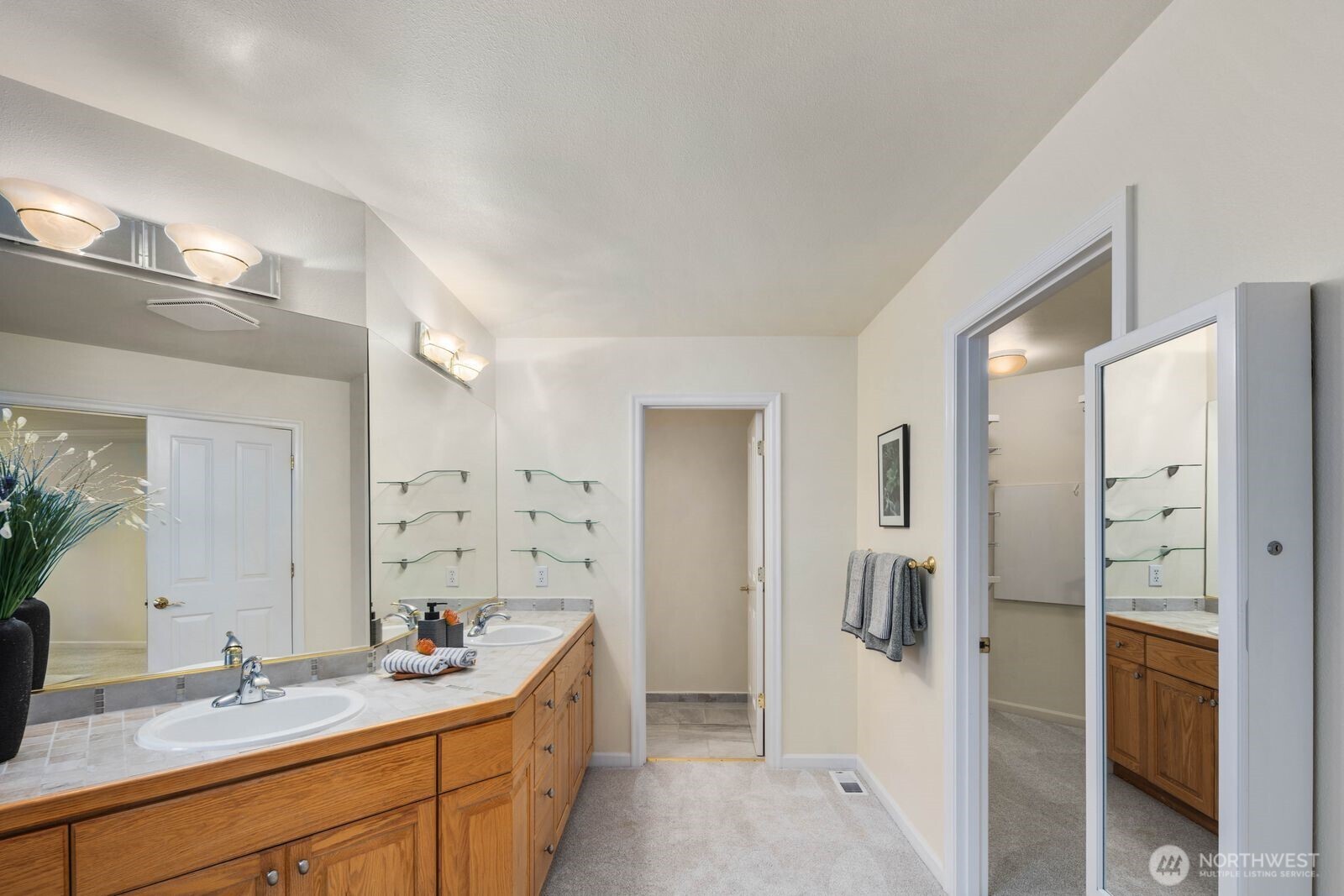 3429 Lincoln Avenue Northeast Renton, WA 98056 - Photo 24 of 40 a bathroom with a double vanity sink mirror and shower