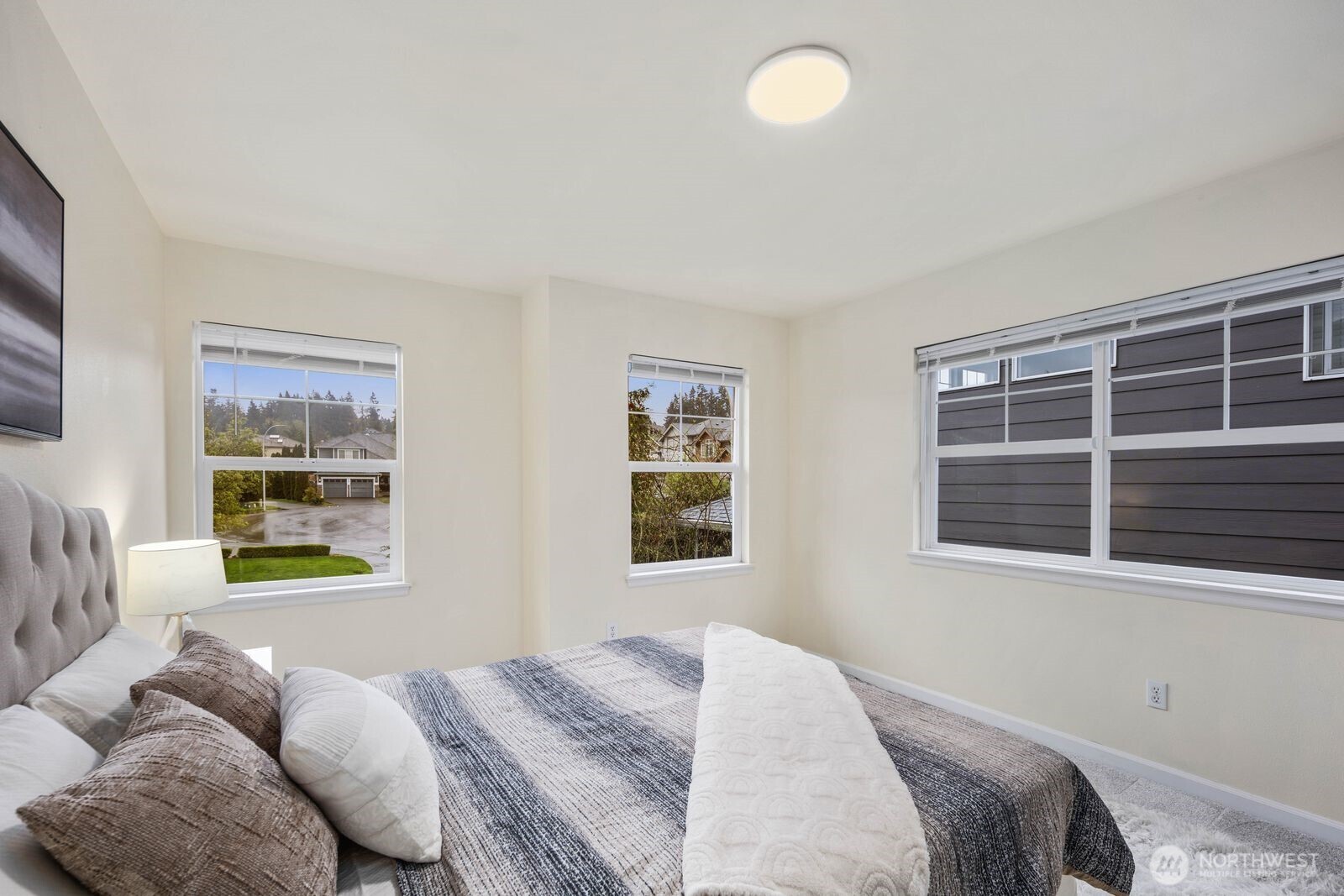 3429 Lincoln Avenue Northeast Renton, WA 98056 - Photo 28 of 40 a bedroom with a bed and a window