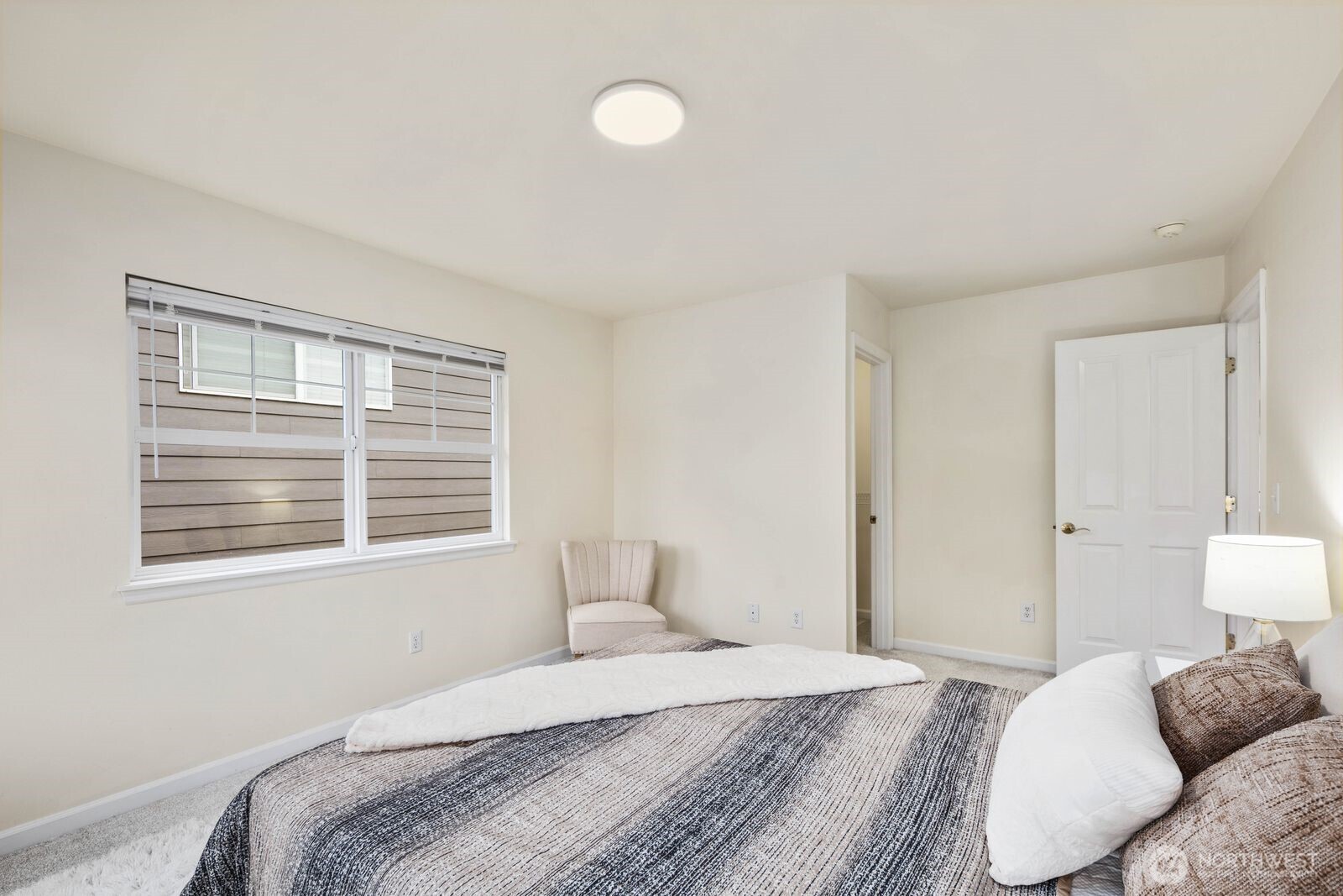 3429 Lincoln Avenue Northeast Renton, WA 98056 - Photo 29 of 40 a bedroom with a bed and a window