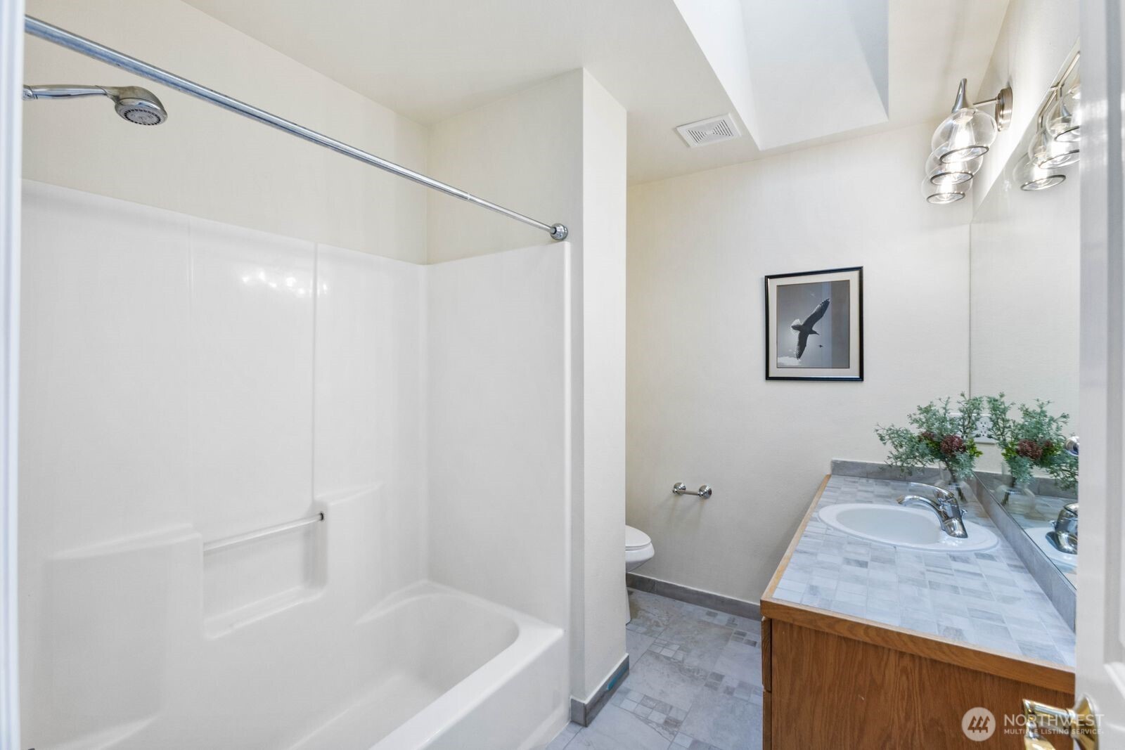 3429 Lincoln Avenue Northeast Renton, WA 98056 - Photo 33 of 40 a bath room with a granite countertop sink and a mirror