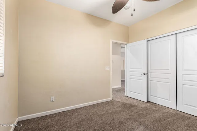 an empty room with closet area