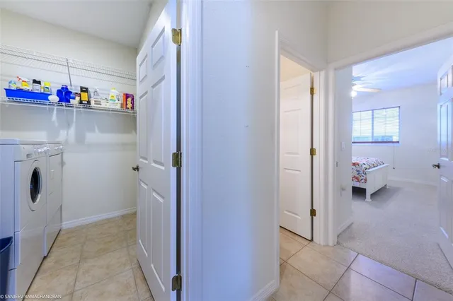 a view of a storage & utility room with two washing machine