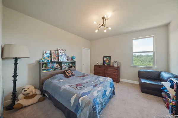 a bedroom with furniture and a bed