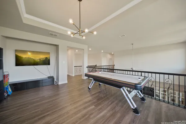 a view of a livingroom with a furniture and wooden floor