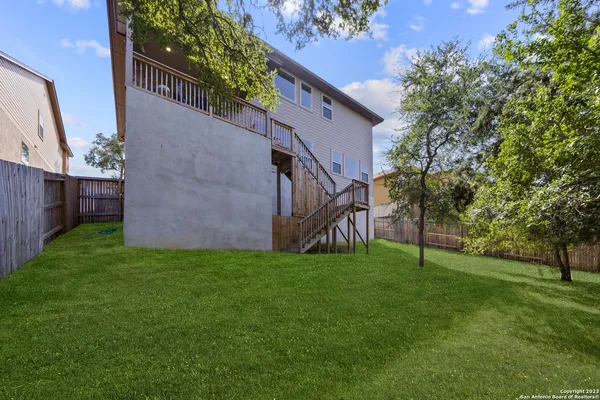 a view of a back yard of the house