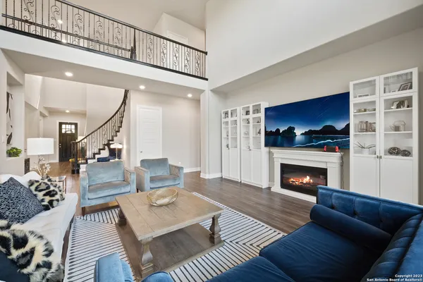 a living room with furniture and a fireplace