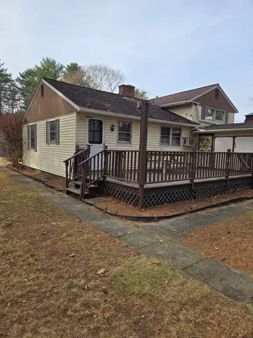 a view of a house with wooden fence