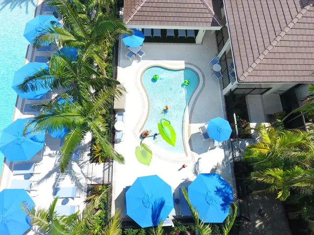 a picture of a building with a garden