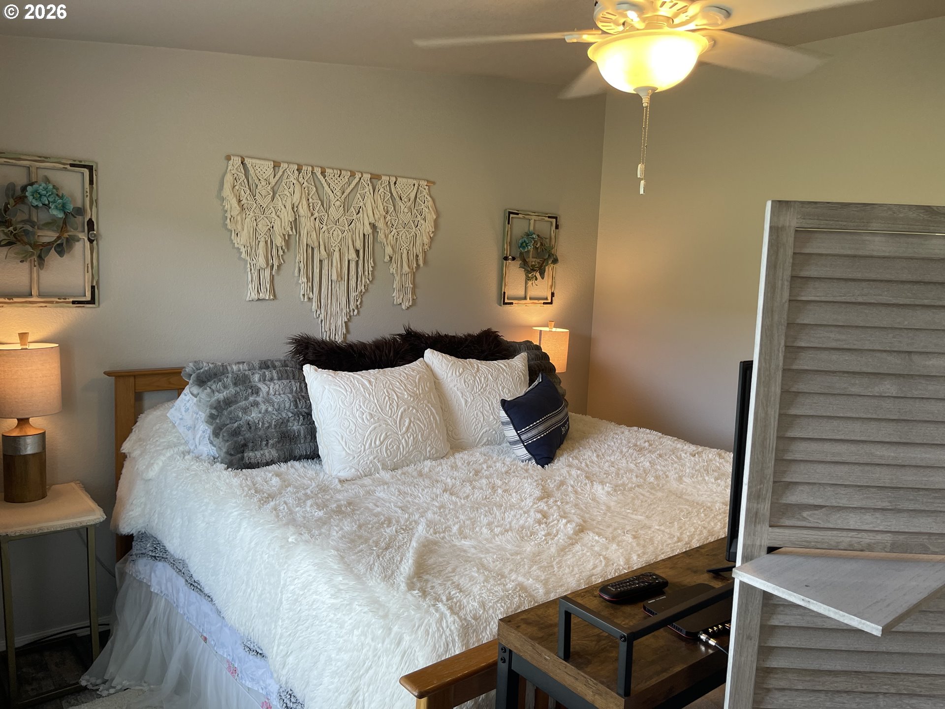 6404 Lookingglass Road Roseburg, OR 97471 - Photo 24 of 48 a bedroom with a bed and a chandelier