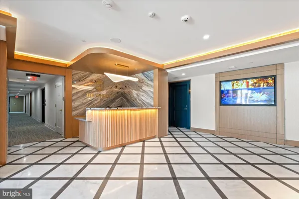 a kitchen with stainless steel appliances a stove a sink and a refrigerator