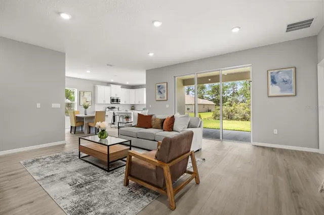 a living room with furniture and a table