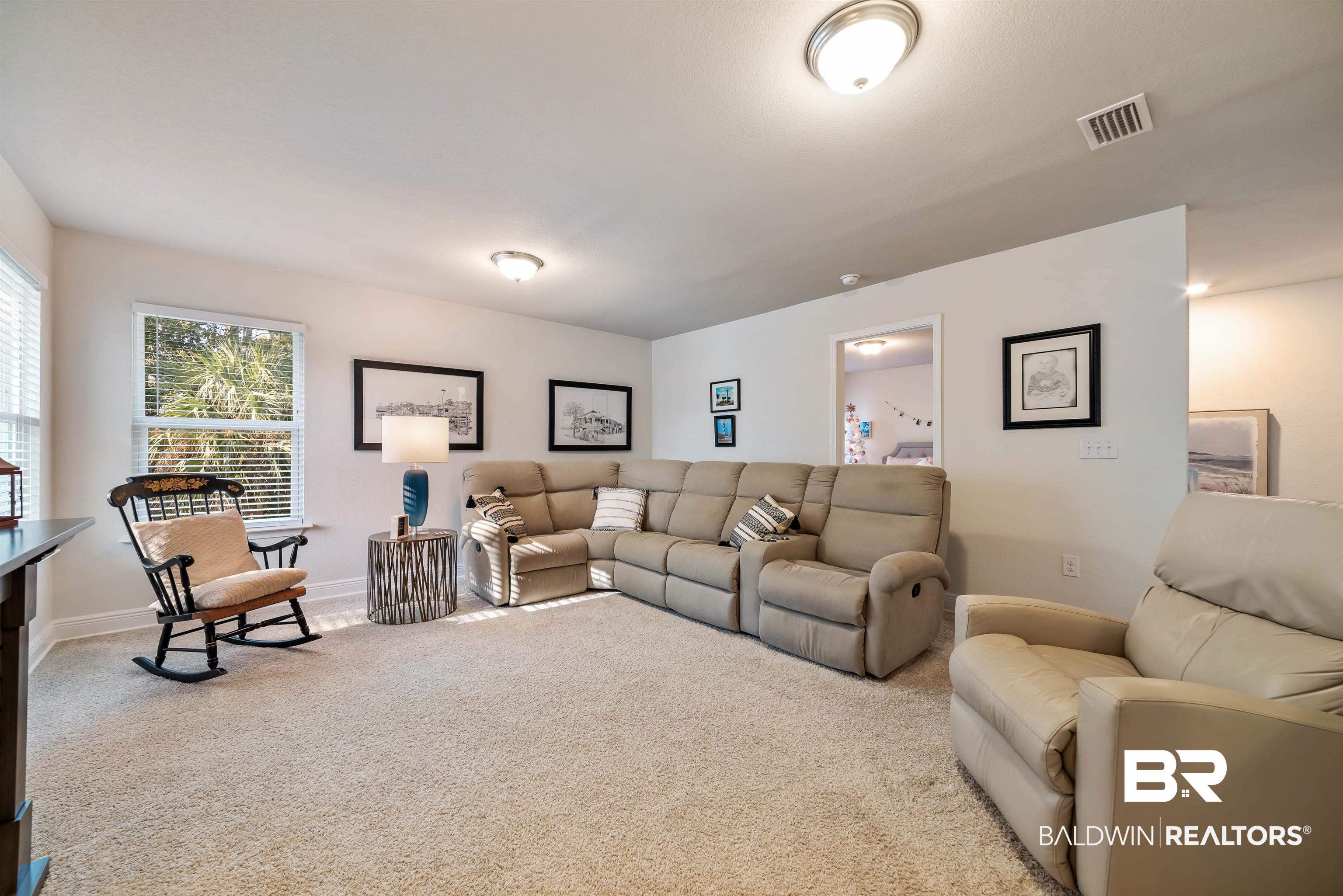 1290 Mako Loop Gulf Shores, AL 36542 - Photo 22 of 50 Living room with carpet floors, visible vents, and baseboards