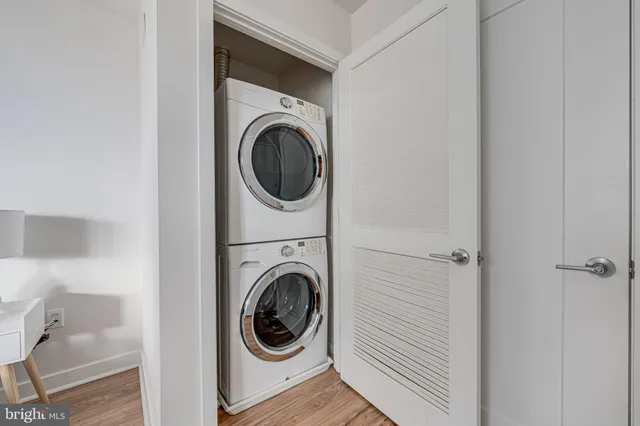a view of a hallway with washer and dryer