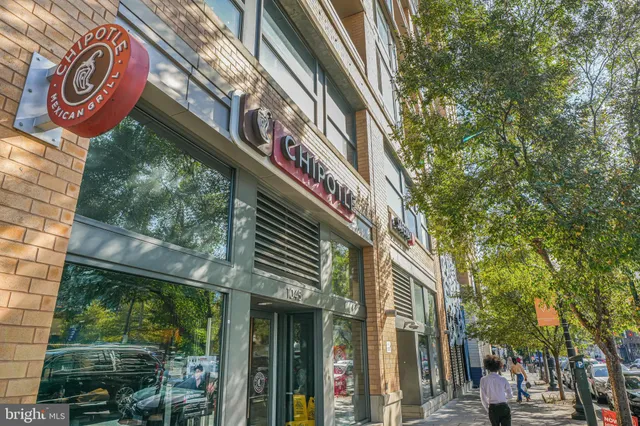 a view of a building with a street sign