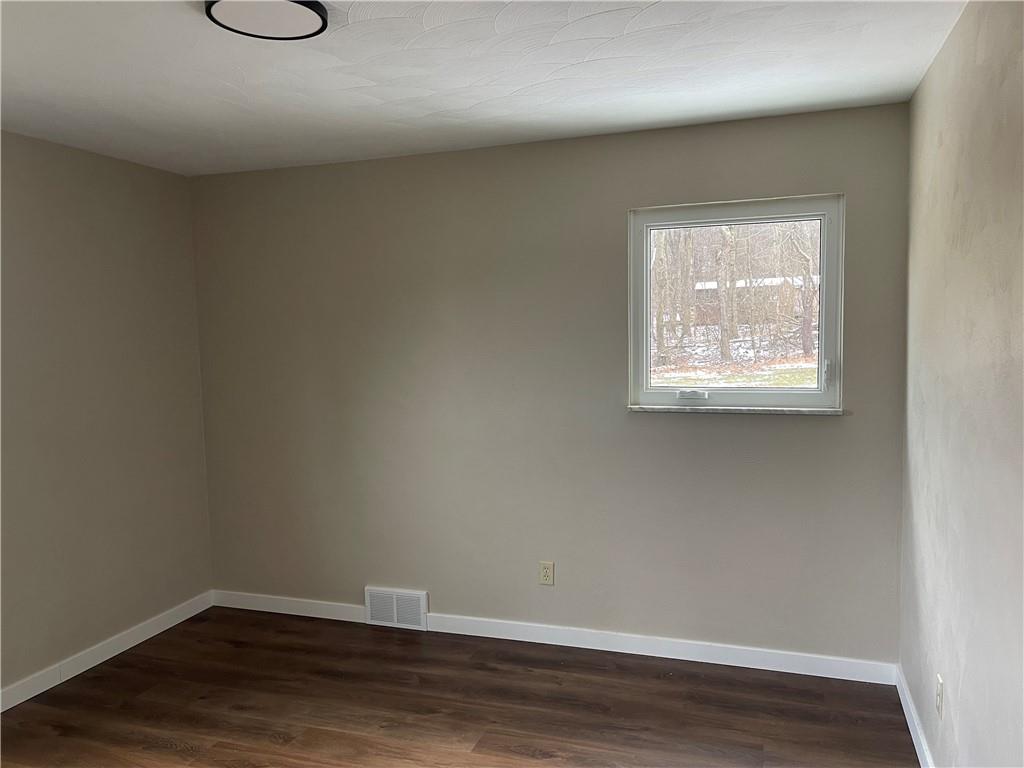 150 Watson Road Apollo, PA 15613 - Photo 16 of 21 an empty room with wooden floor and windows
