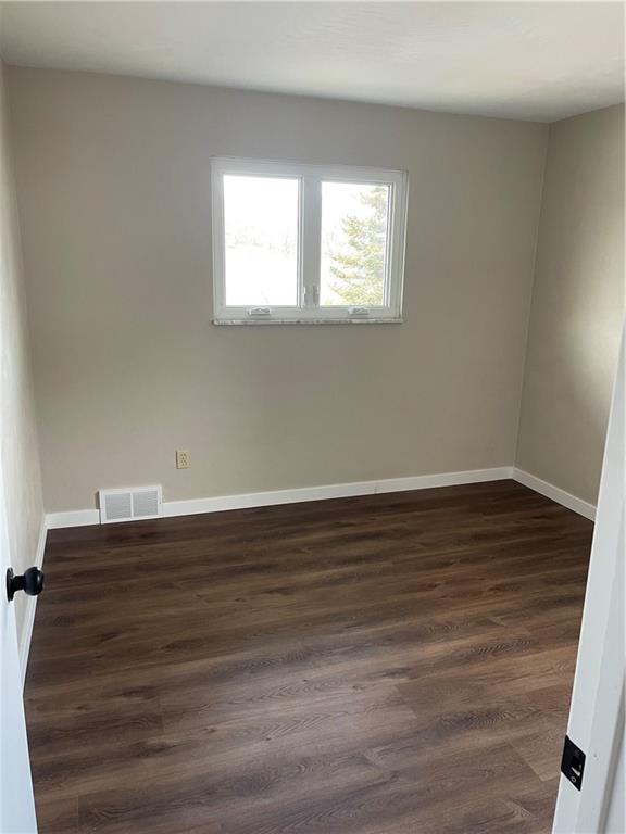 150 Watson Road Apollo, PA 15613 - Photo 19 of 21 an empty room with wooden floor and windows