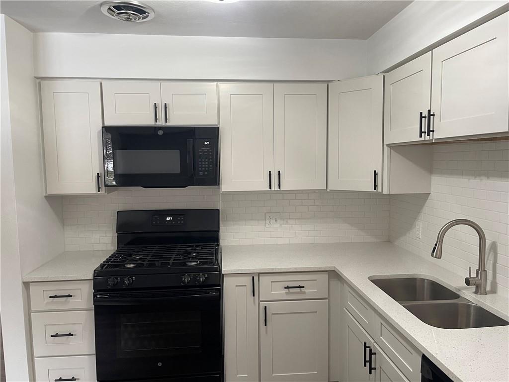 150 Watson Road Apollo, PA 15613 - Photo 4 of 21 a kitchen with a sink stove and microwave