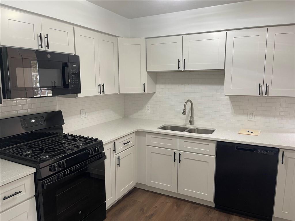 150 Watson Road Apollo, PA 15613 - Photo 5 of 21 a kitchen with white cabinets and appliances