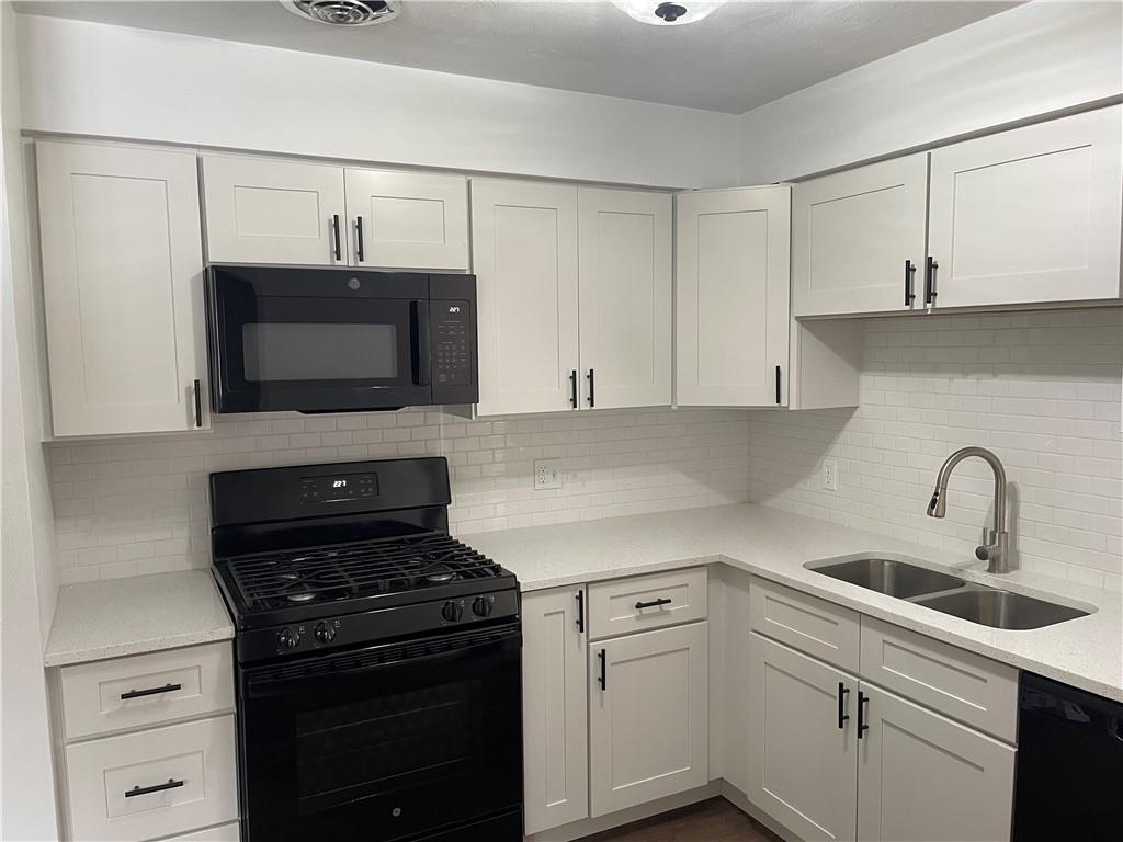 150 Watson Road Apollo, PA 15613 - Photo 6 of 21 a kitchen with a sink appliances and cabinets